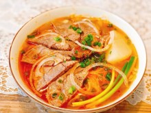Image: Homemade recipe for Bun Bo Hue Hue style beef noodle soup with tomato sauce and coconut milk