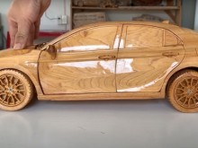 Image: Close-up of extremely sophisticated wooden Toyota Camry by Vietnamese carpenters