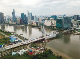 Image: 4 bridges span the Saigon River connecting Thu Thiem