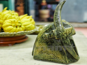 Image: Vietnamese artisan features traditional culture through ceramic buffalo sculptures