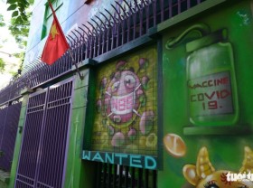 Image: Artist paints murals on house to raise awareness of COVID-19 prevention in Hanoi