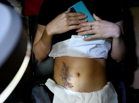 Image: Scar tissue: Vietnamese women find healing with tattoos