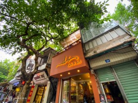 Image: Coffee shop looking at dó paper paintings