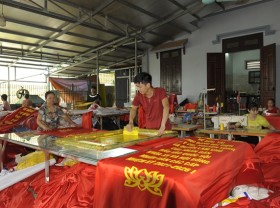 Image: Trade village busy making flags ahead of national election