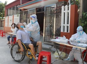 Image: Vietnam witnesses triple-digit Covid-19 spike
