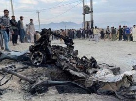 Image: Afghan school blast toll rises to 58, families bury victims