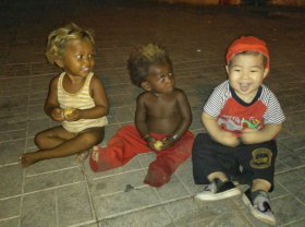 Image: Young father takes children backpacking to learn life skills