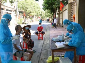 Image: Vietnam’s Covid-19 cases surpass 12,000