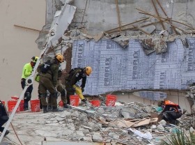 Image: Searchers find 11th body in ruins of Florida condominium tower