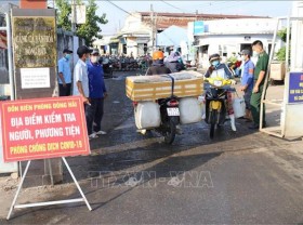 Image: All localities expand home quarantine period to 14 days for returnees from HCMC