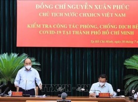 Image: President works with leaders of Ho Chi Minh City