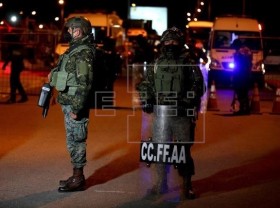 Image: Ecuador says at least 18 inmates die in two prison riots
