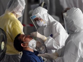 Image: Thailand bans public gatherings as coronavirus cases and deaths hit daily records