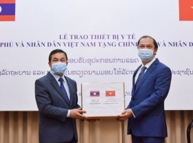 Image: Vietnam and Laos join hands to fight back the pandemic