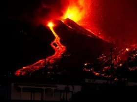 Image: Thousands flee as lava spewing from volcano on Spain's La Palma island destroys houses