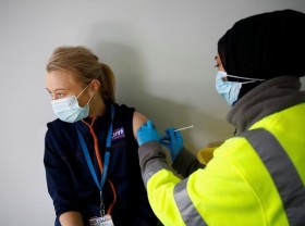 Image: Britain allows early booking of booster shots to speed up rollout