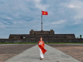 Image: Young people in ao dai promote Hue as a safe and friendly destination