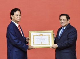 Image: Former Prime Minister presented with 55-year Party membership badge