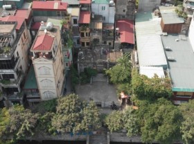 Image: 100-year-old stone mausoleum in the middle of Hanoi