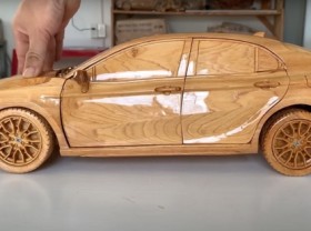 Image: Close-up of extremely sophisticated wooden Toyota Camry by Vietnamese carpenters