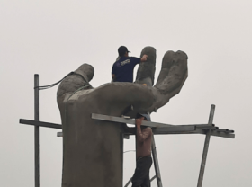 Image: The arm statue on Hai Tien beach in Viet Nam is controversial