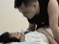 Image: A Heartfelt Farewell: Husband Kisses Wife Goodbye in Hospital