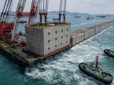 Image: China Sinks 34 Concrete Buildings into Sea for Coastal Defense