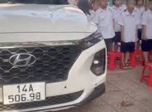 Image: Deputy Principal Parks Car During Student Flag Ceremony
