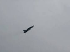 Image: Dramatic Escape: Pilots Parachute Before Plane Explosion