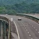 Image: Woman Steps Out of Car and Lies Down on Highway