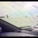 Image: Large Rock Falls from Overpass, Shattering Car Window on Highway
