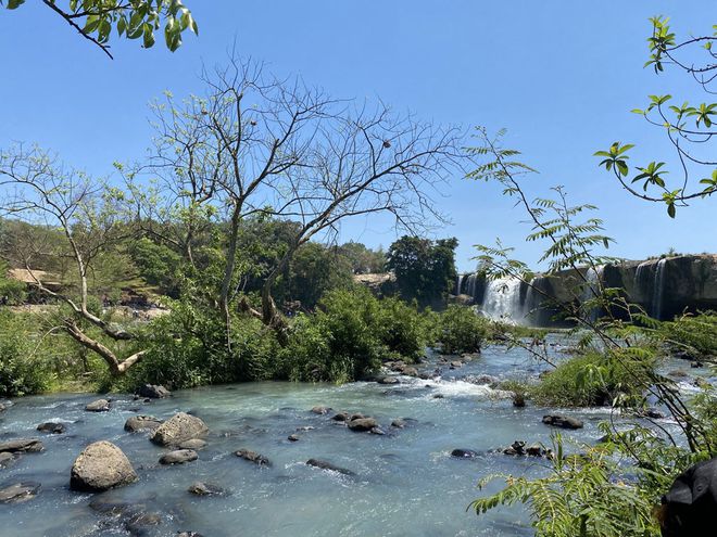 Young people “hide from the sun” at the majestic Dray Nur waterfall