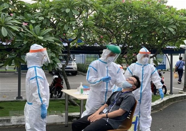 HCMC asks hospitals to test patients showing symptoms of fever, cough