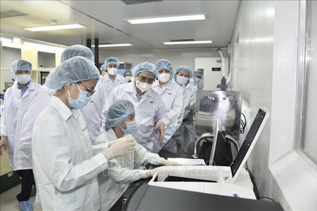 PM wants local Covid-19 vaccines available by June 2022