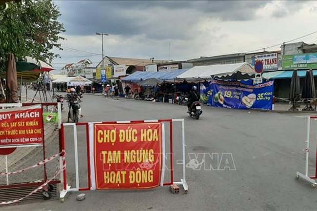Surge in Covid-19 cases prompts Long An to begin social distancing
