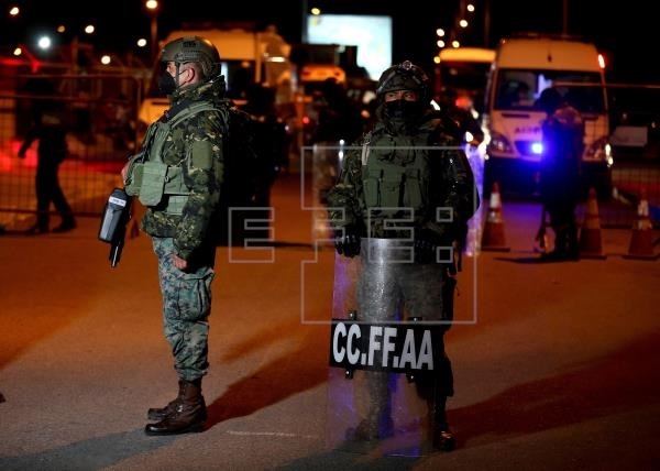 Ecuador says at least 18 inmates die in two prison riots