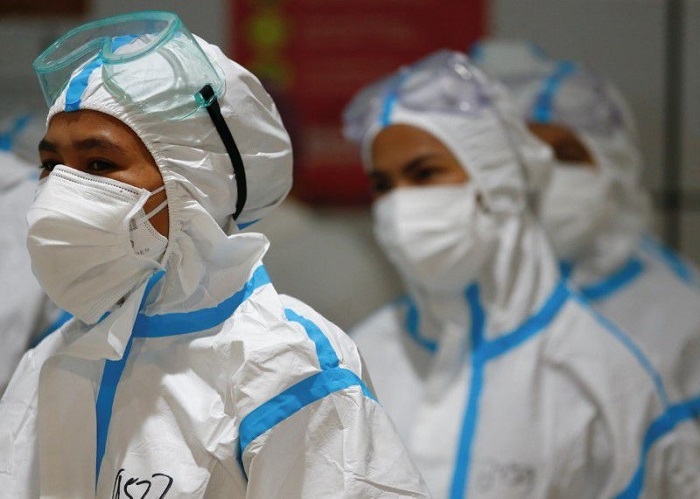 Indonesia prepares more ICU units, waits to see if COVID curbs will be extended
