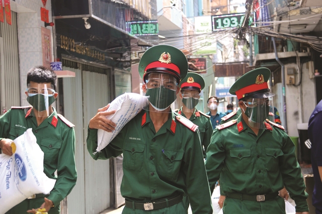 Soldiers help HCM City residents in coronavirus battle
