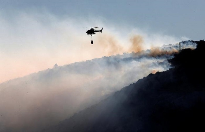 Hundreds of firefighters tackle wildfire in southern France