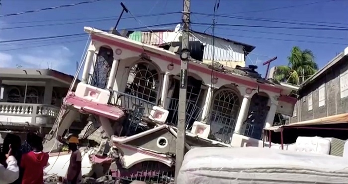 Rescuers race to find Haiti quake survivors as death toll hits 1,297