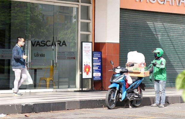 Ho Chi Minh City allows food and drink takeaway services