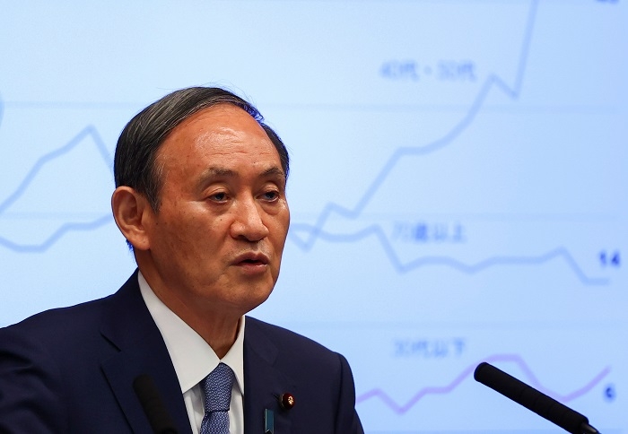 Japan PM Suga says he won't run in LDP race to focus on COVID-19 measures
