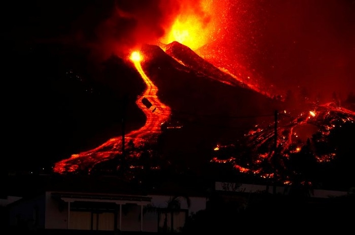 Thousands flee as lava spewing from volcano on Spain's La Palma island destroys houses