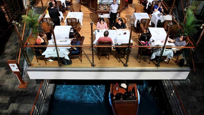 Singapore relaxes tight COVID-19 social curbs from Monday
