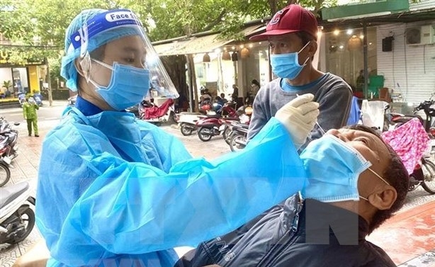 Vietnam records 13,698 new COVID-19 cases