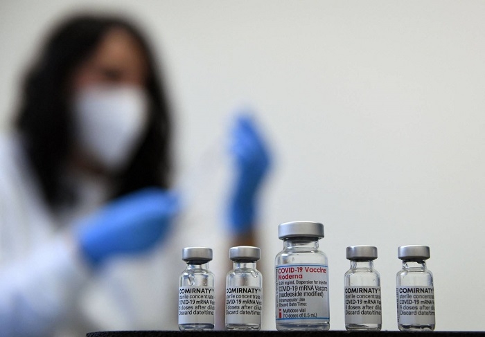 Officials offer vaccine reassurance; WHO advises against travel bans
