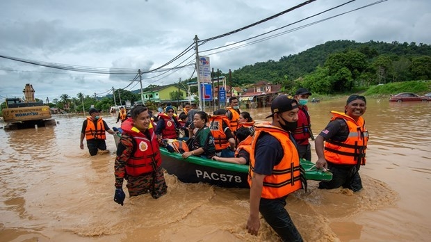Seven dead, more than 50,000 evacuated in Malaysia floods