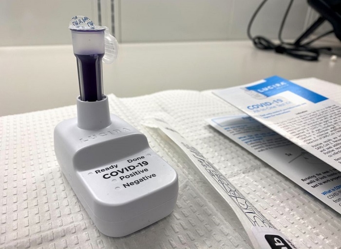 To fight Omicron, Biden sets new travel rules and adds free COVID tests