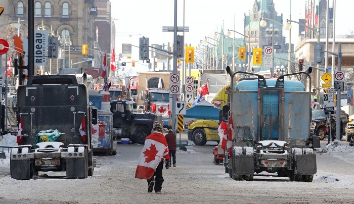 Key US-Canada border crossing blocked by truckers fighting Trudeau's COVID curbs