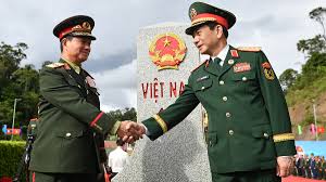 General Phan Van Giang Visits Laos for Friendship Exchange